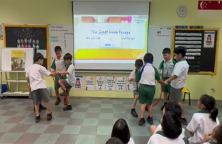 Students performing a role-play during a classroom character education lesson.