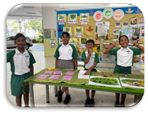Students presenting their Tamil language project at a school exhibition.