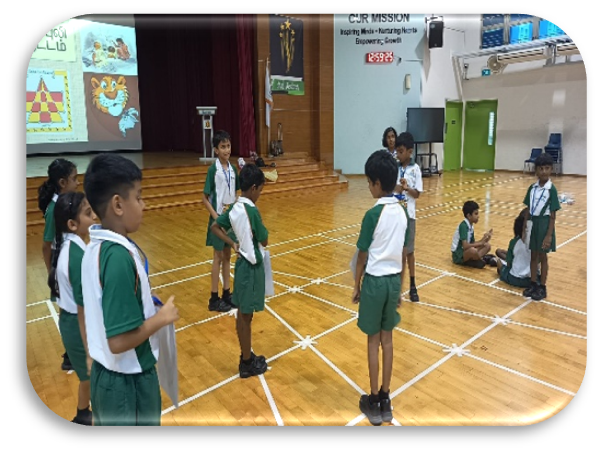 Students taking part in a Tamil language group activity in the school hall.